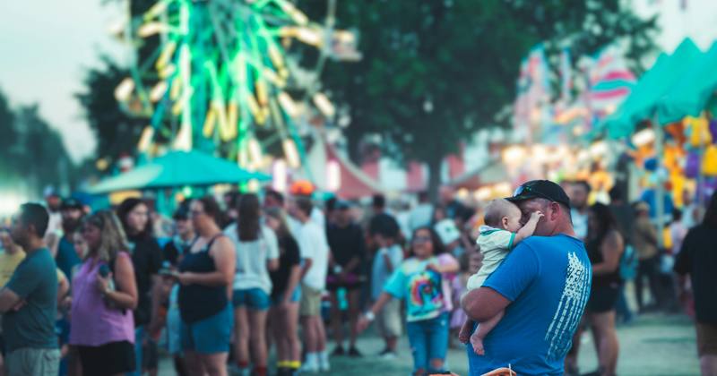 Family with stroller at theme park